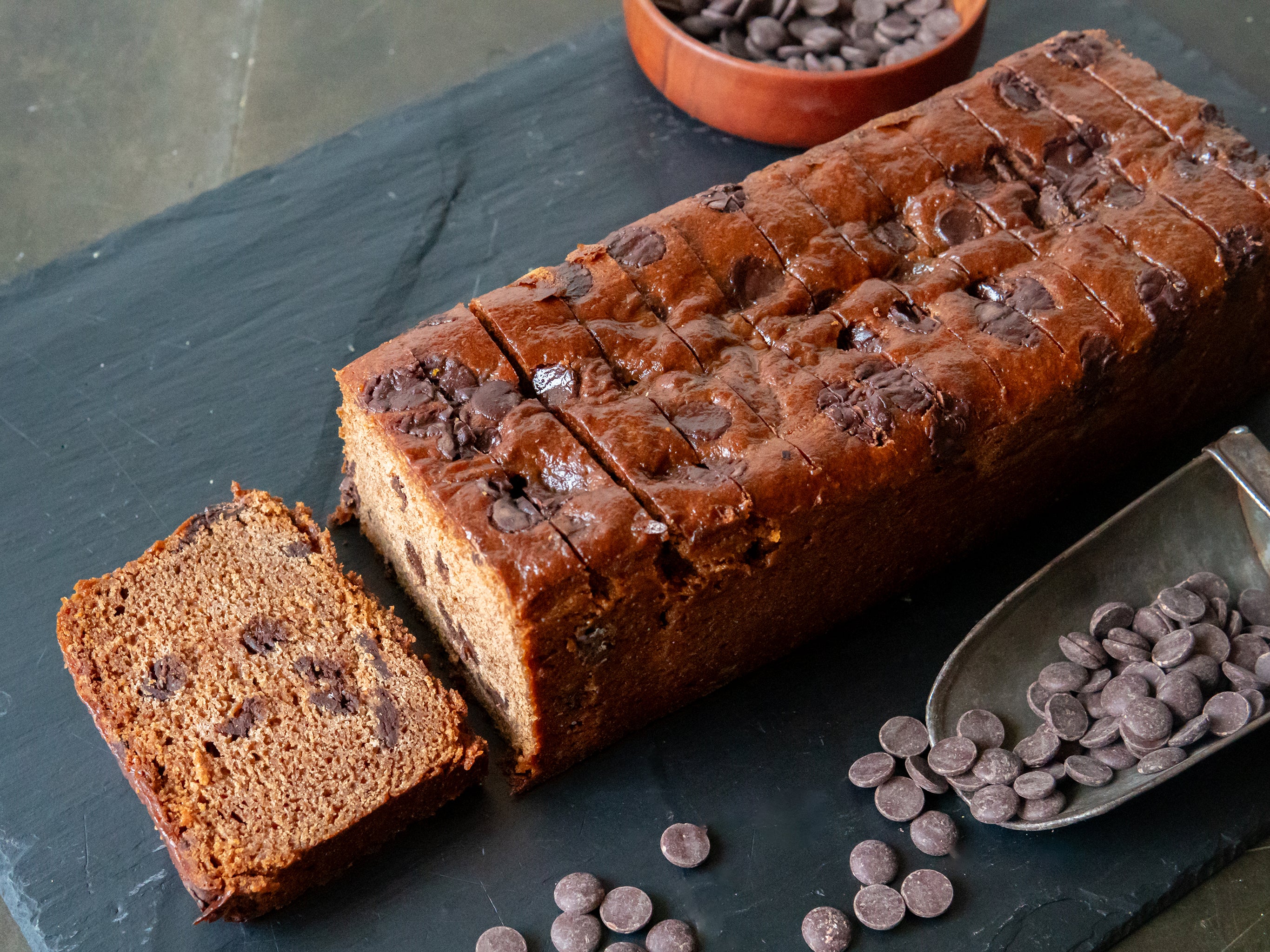 A pre-sliced loaf of Wholesale Banana & Chocolate Loaf | Cakesmiths