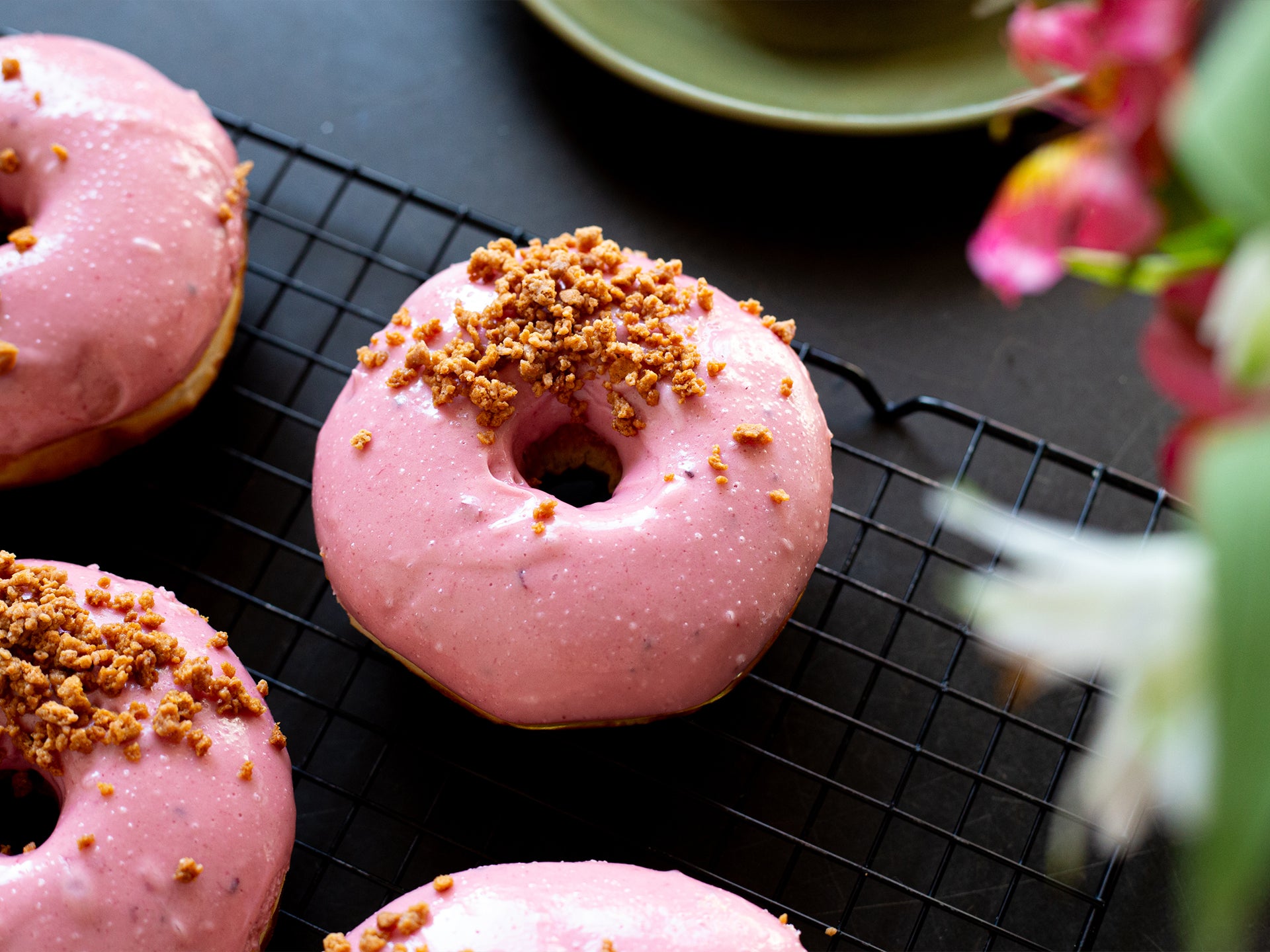 A tray of our limited edition blackberry crumble doughnuts from Cakesmiths