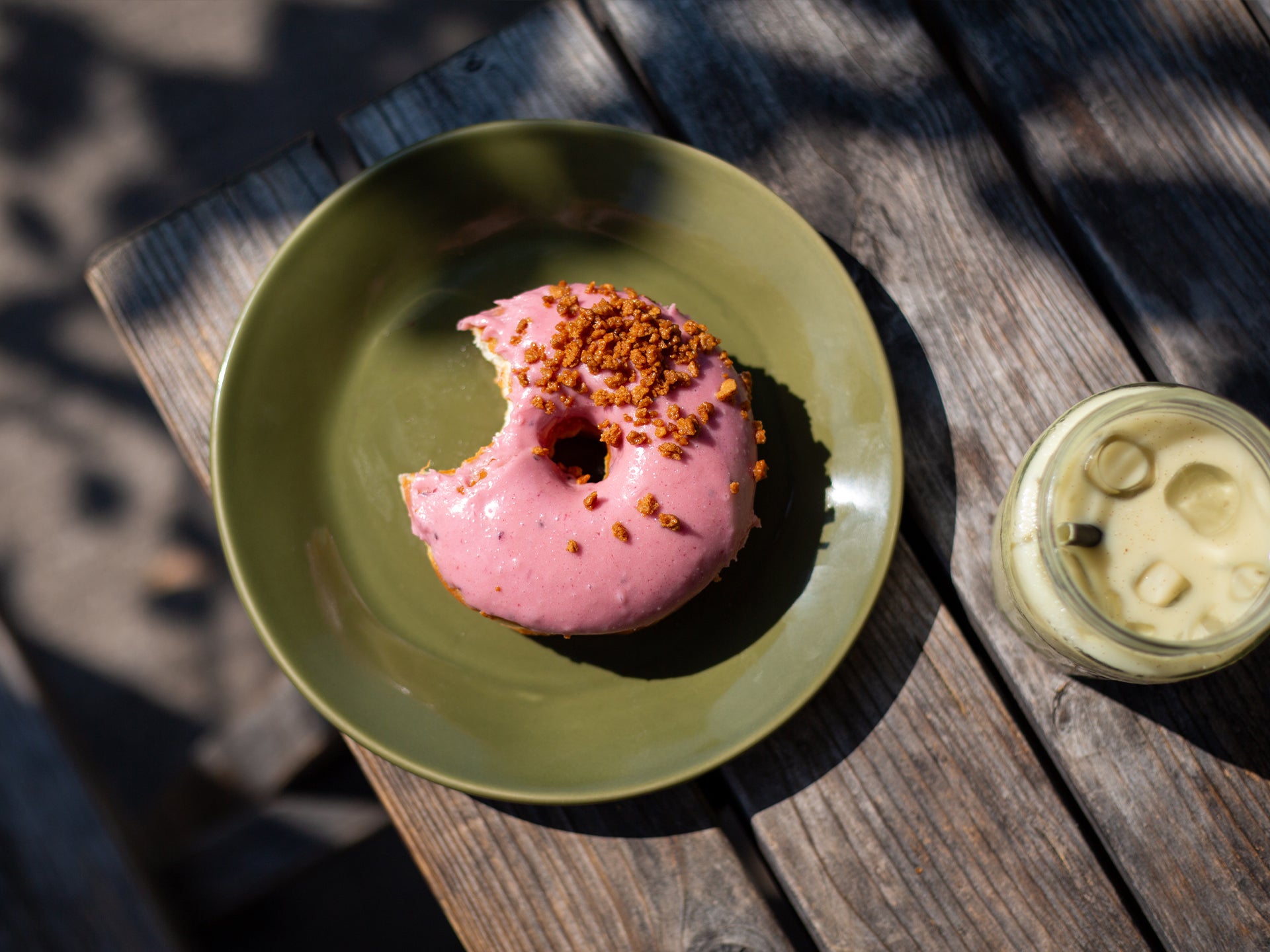 A wholesale Blackberry Crumble Doughnut from Cakesmiths