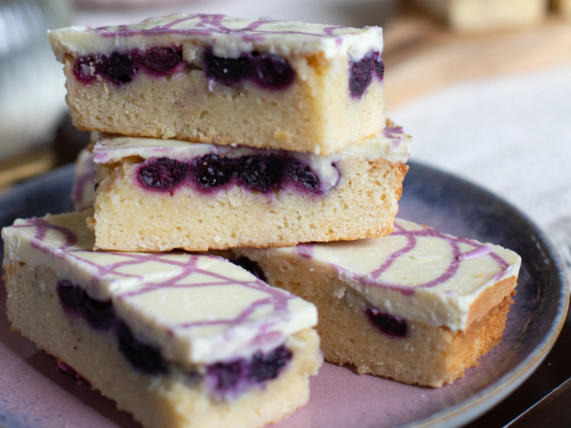 White Chocolate Blueberry Blondie bars on a plate
