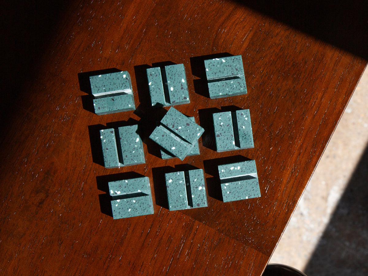 Green Terrazzo Product Display Card Stands rectangular blocks on a wooden surface