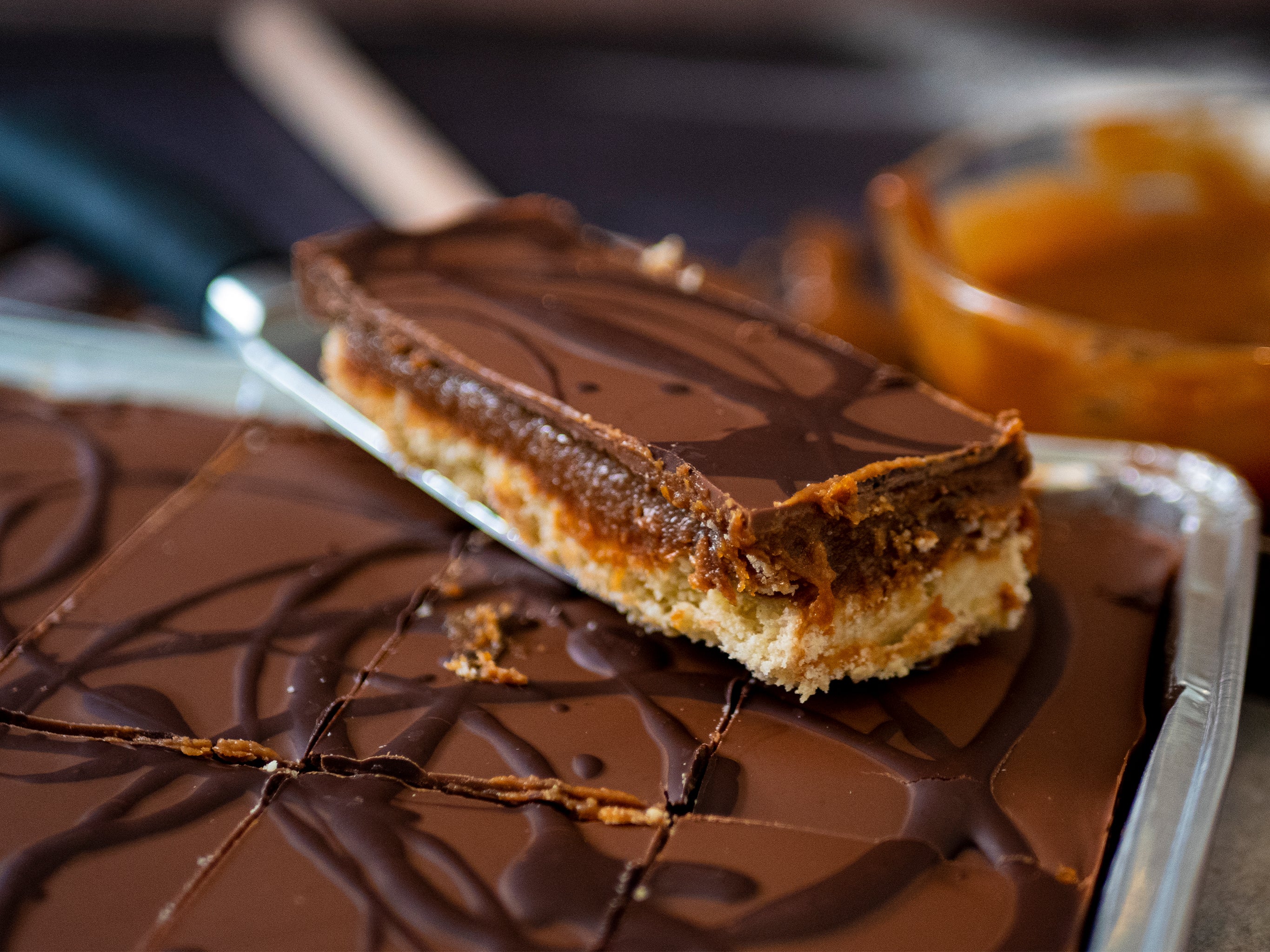 A slice of wholesale Billionaire's Shortbread