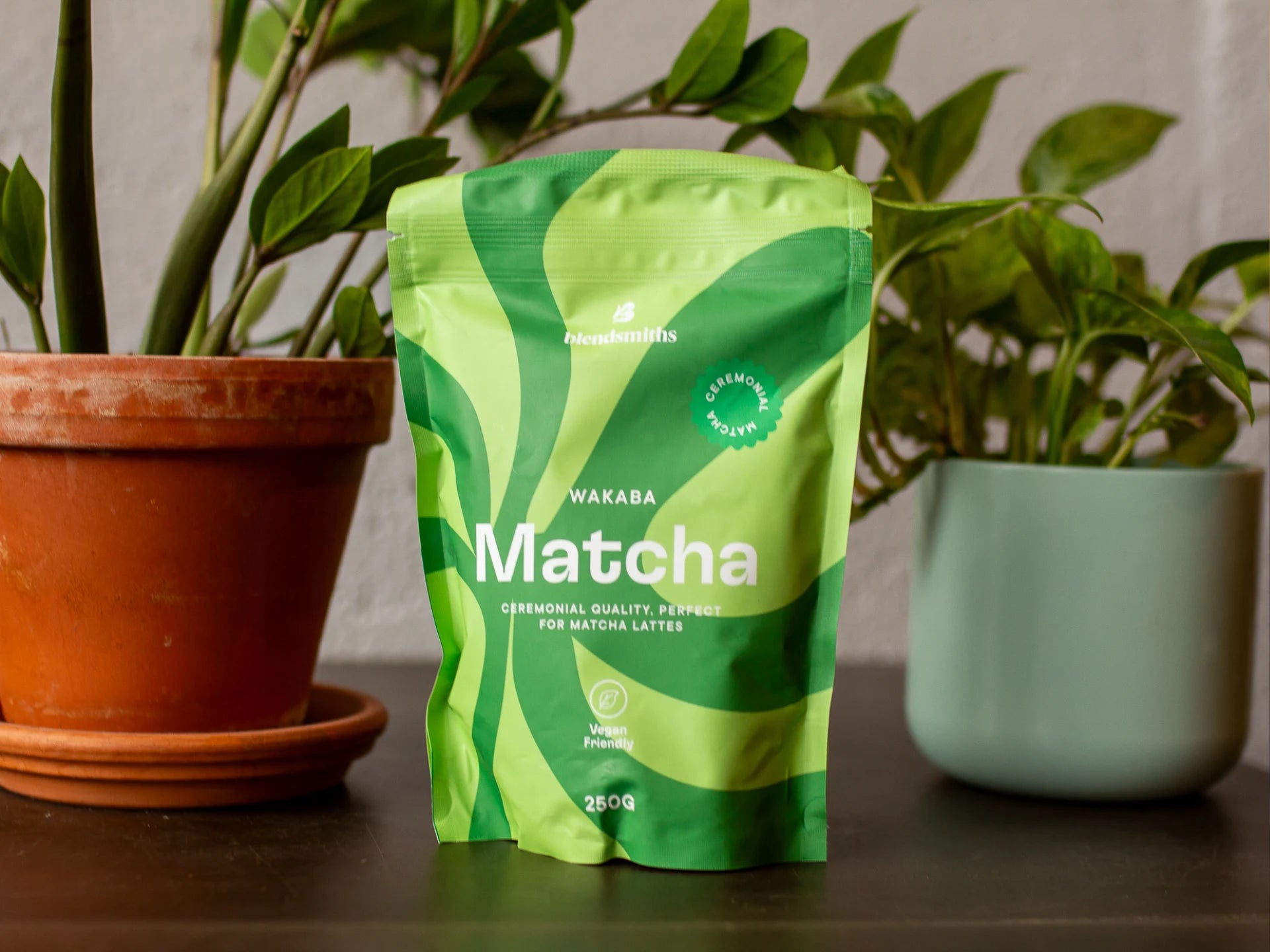 Ceremonial-Quality Wakaba Matcha package on a table with plants in the background