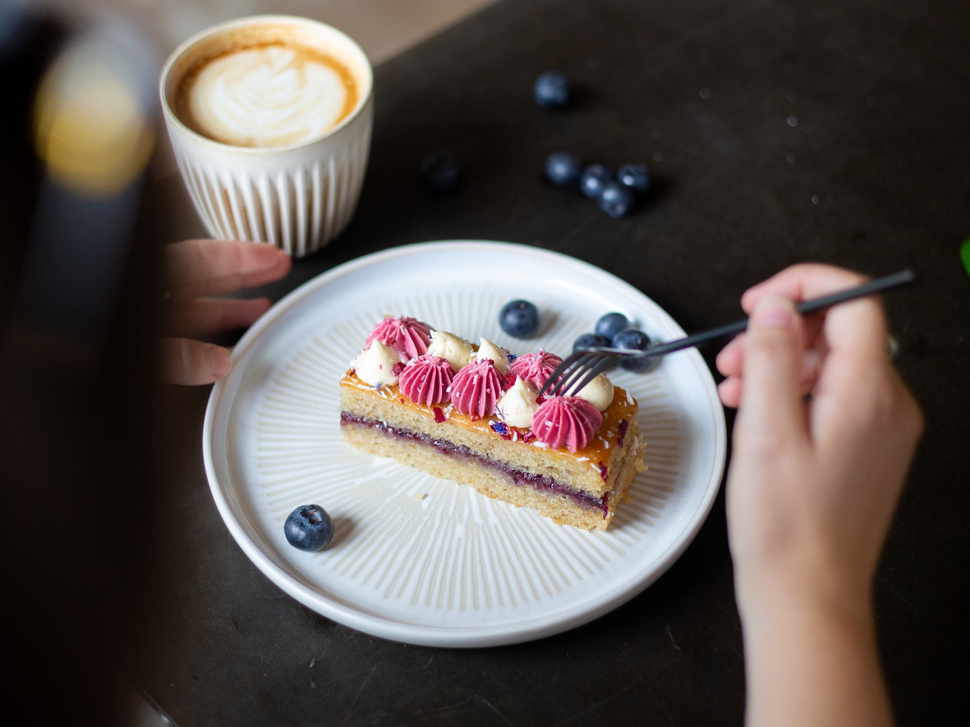 A serving of our wholesale blueberry & coconut traycake