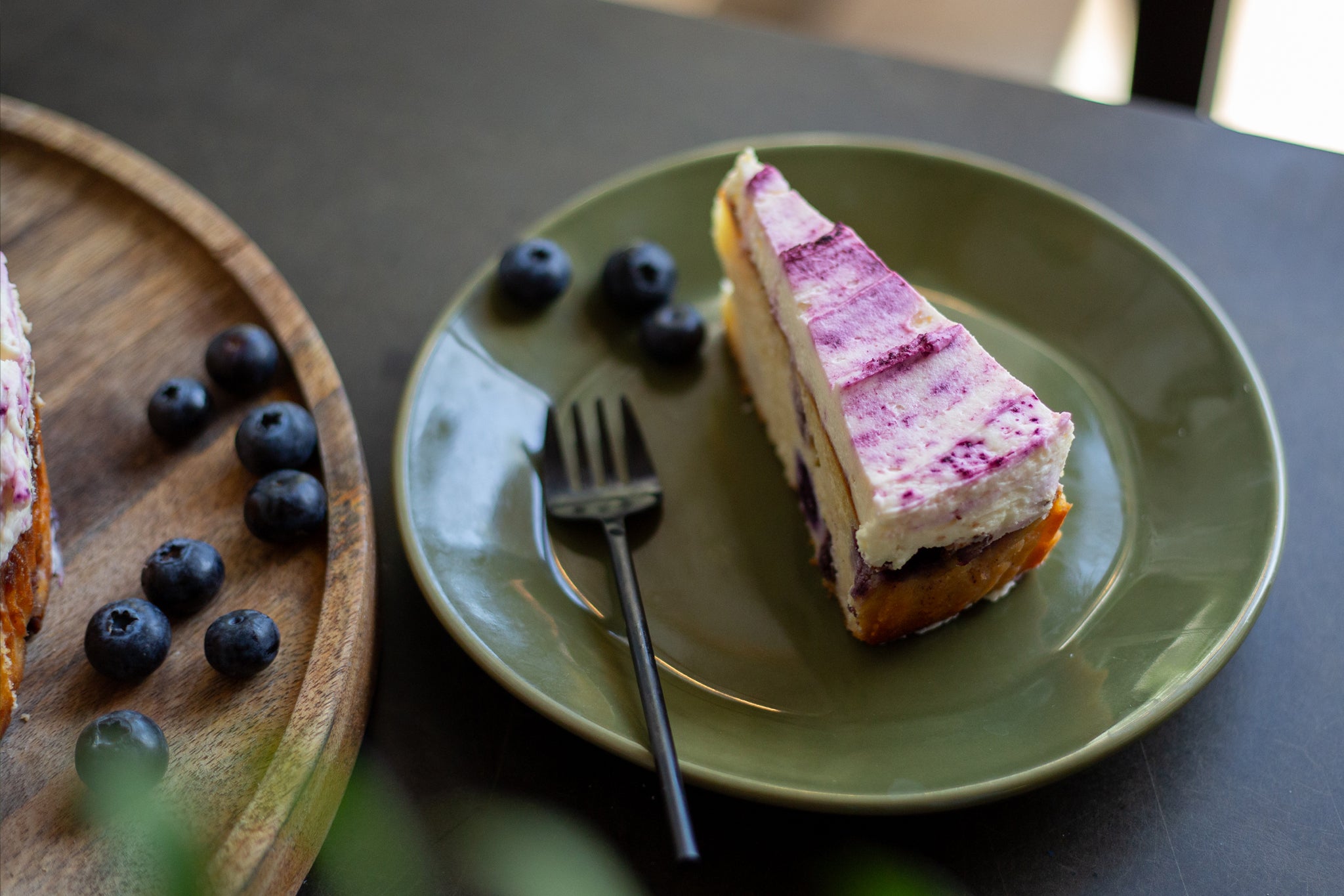 Serve a slice of Blueberry & Lime Round with some extra blueberries | Cakesmiths for Coffee Shops