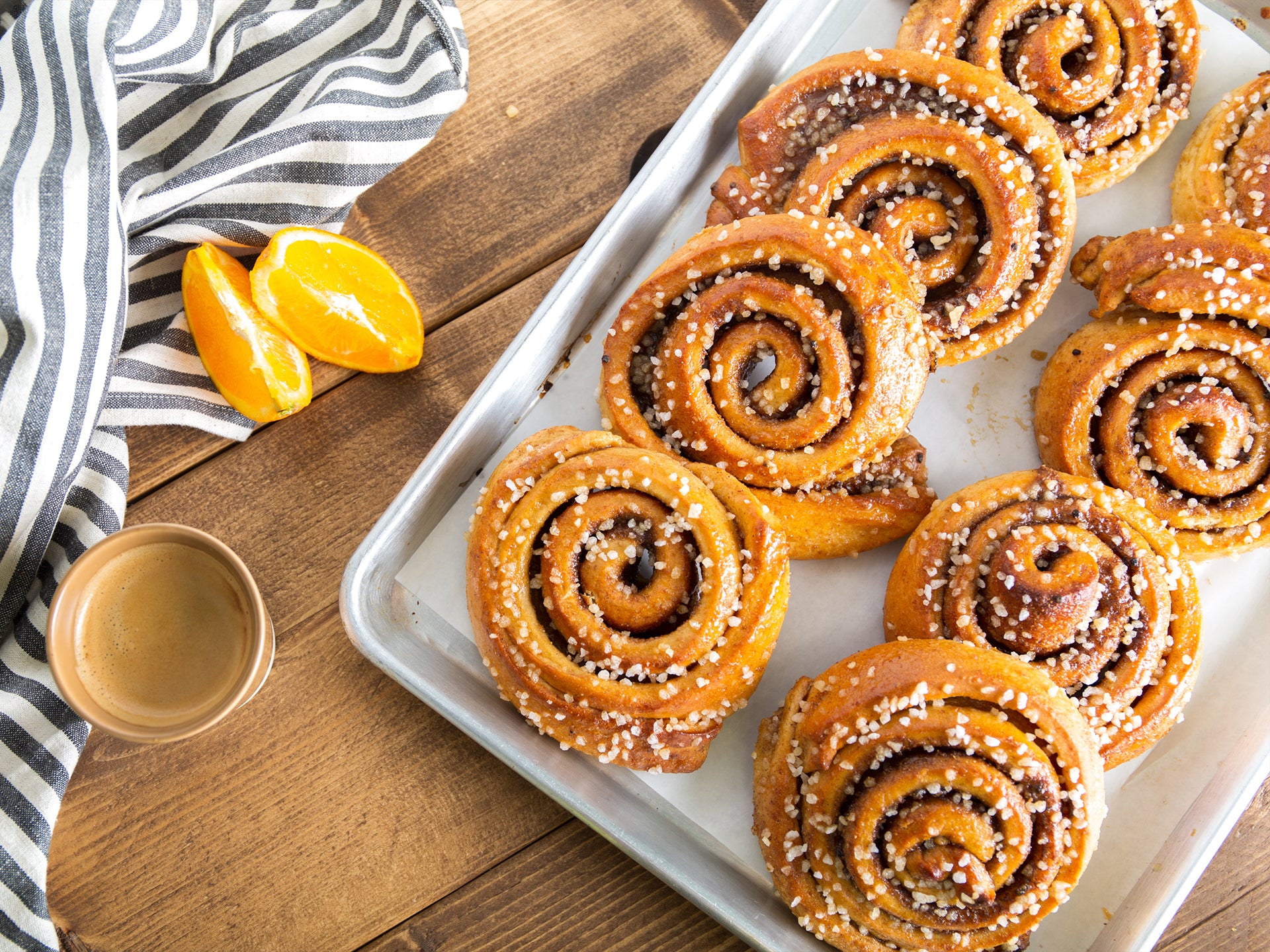 A tray of wholesale sticky buns flavoured with orange and cardamom