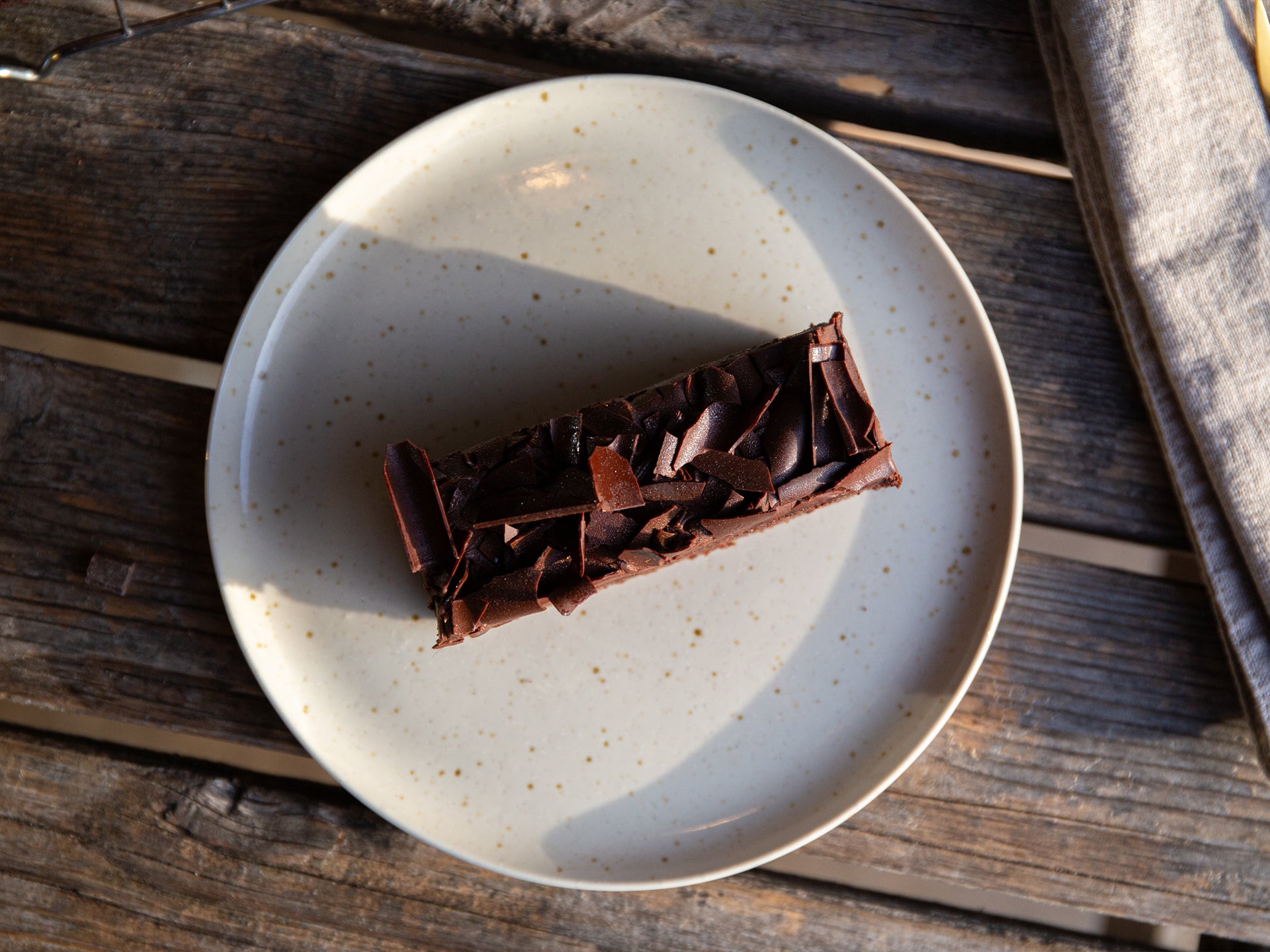 A decadent slice of double chocolate fudge cake, made by Cakesmiths