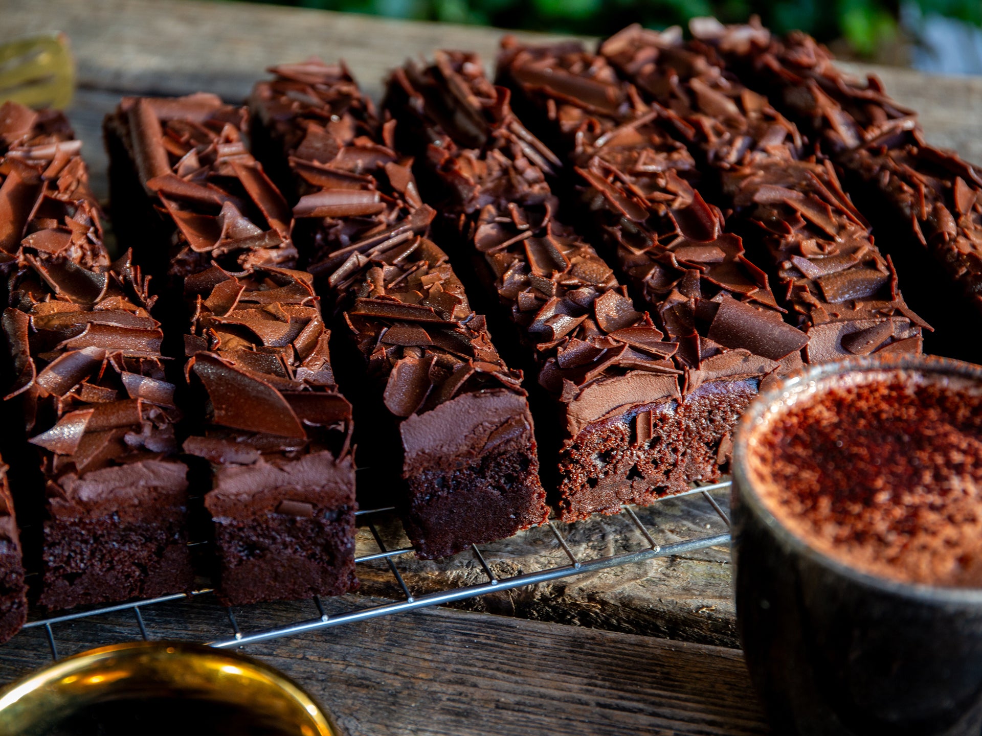 A tray of our Double Chocolate Fudge cake served with a cup of hot chocolate