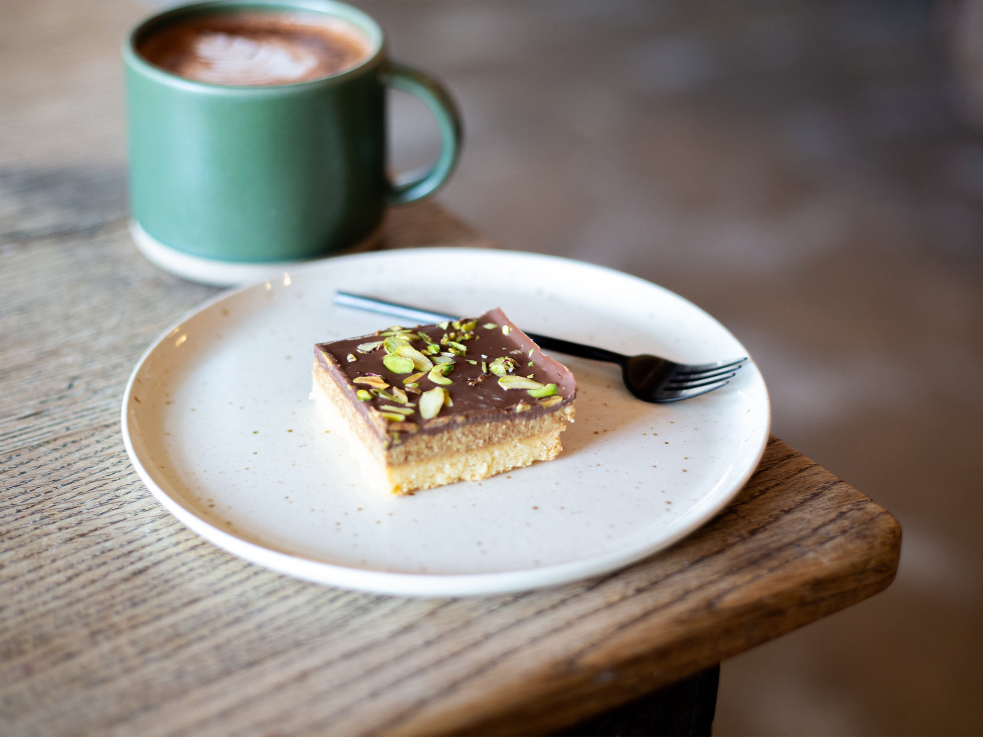 A square of chocolate & pistachio shortbread