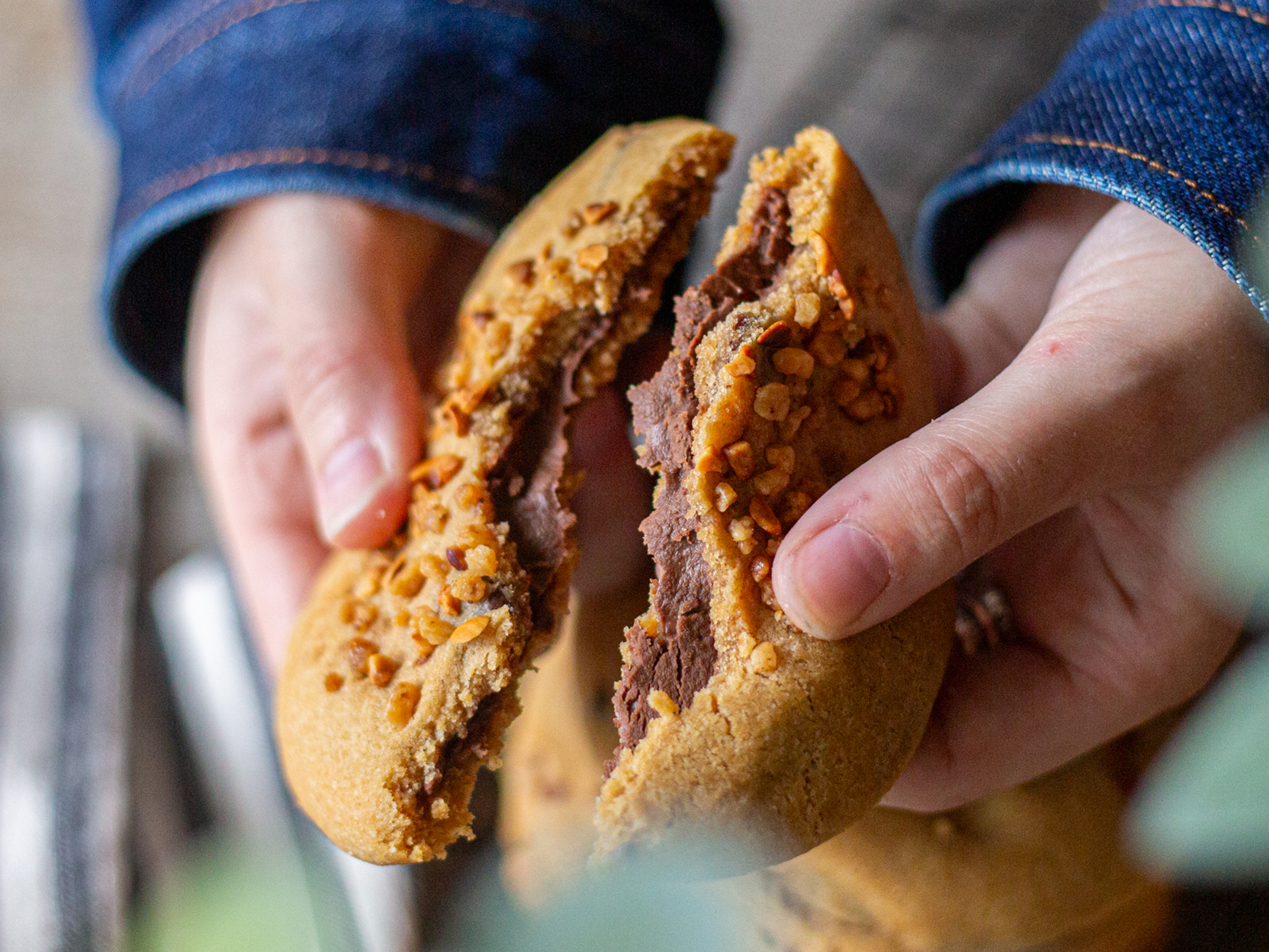 Break open a hazelnut creme filled cookie from Cakesmiths