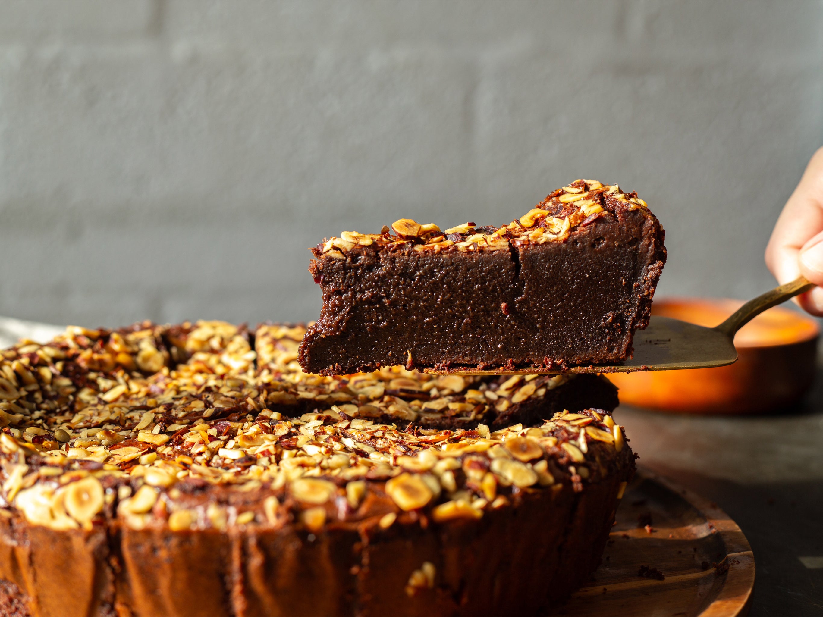 A slice of our wholesale dessert round made with chocolate and hazelnuts