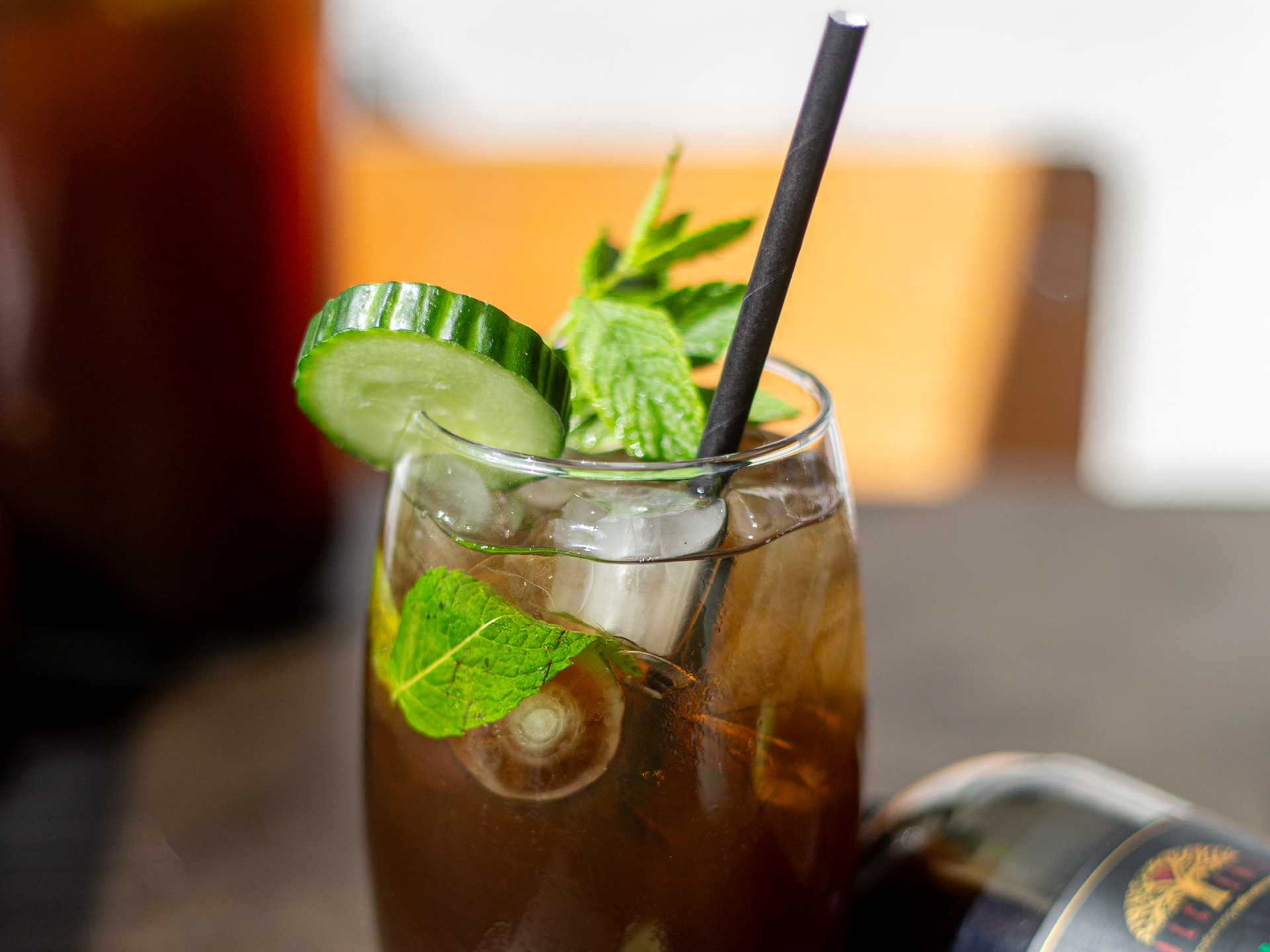 Cucumber Iced Tea with black straw
