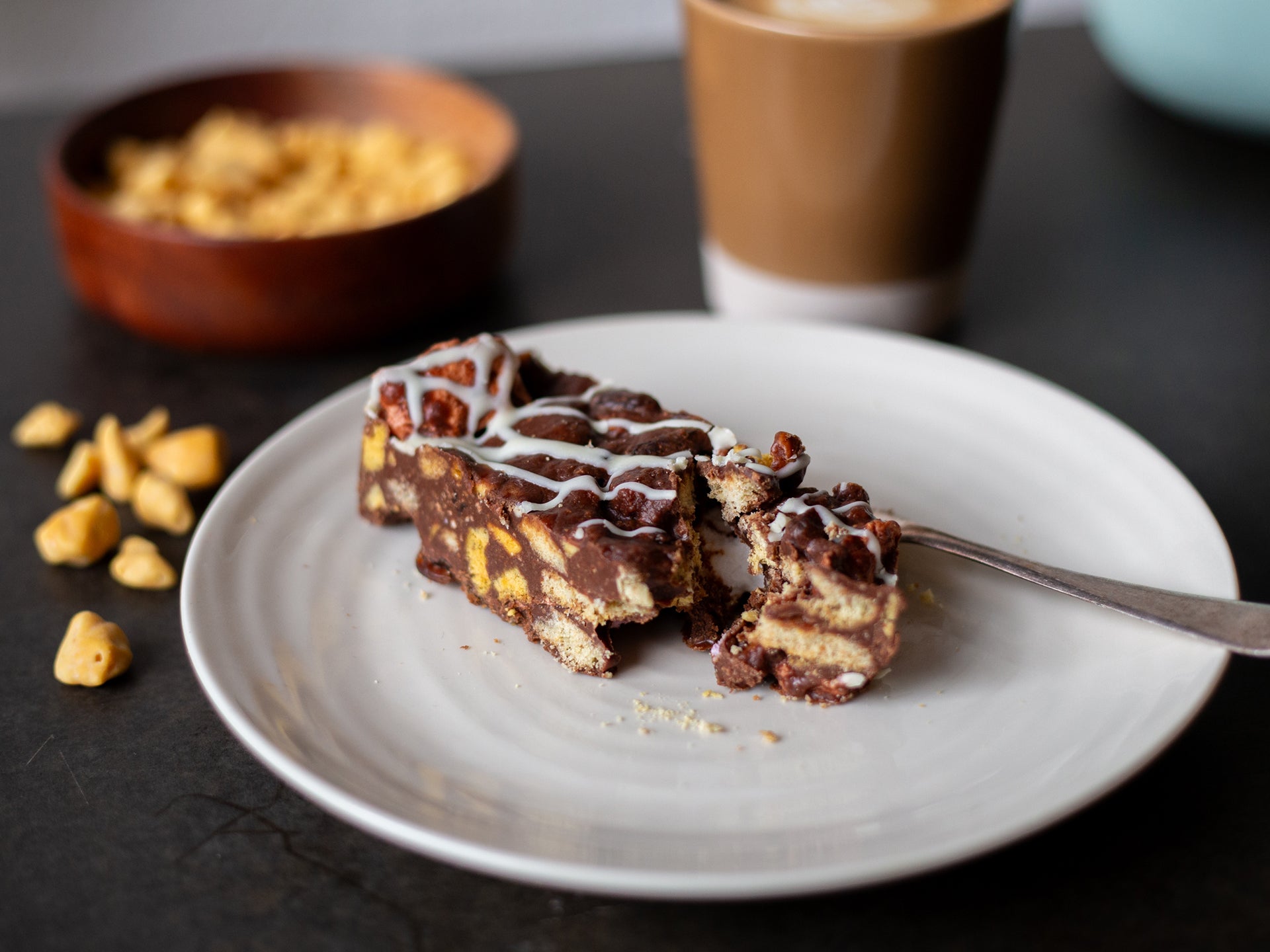 A slice of our biscuit filled Honeycomb Rocky Road wholesale traybake