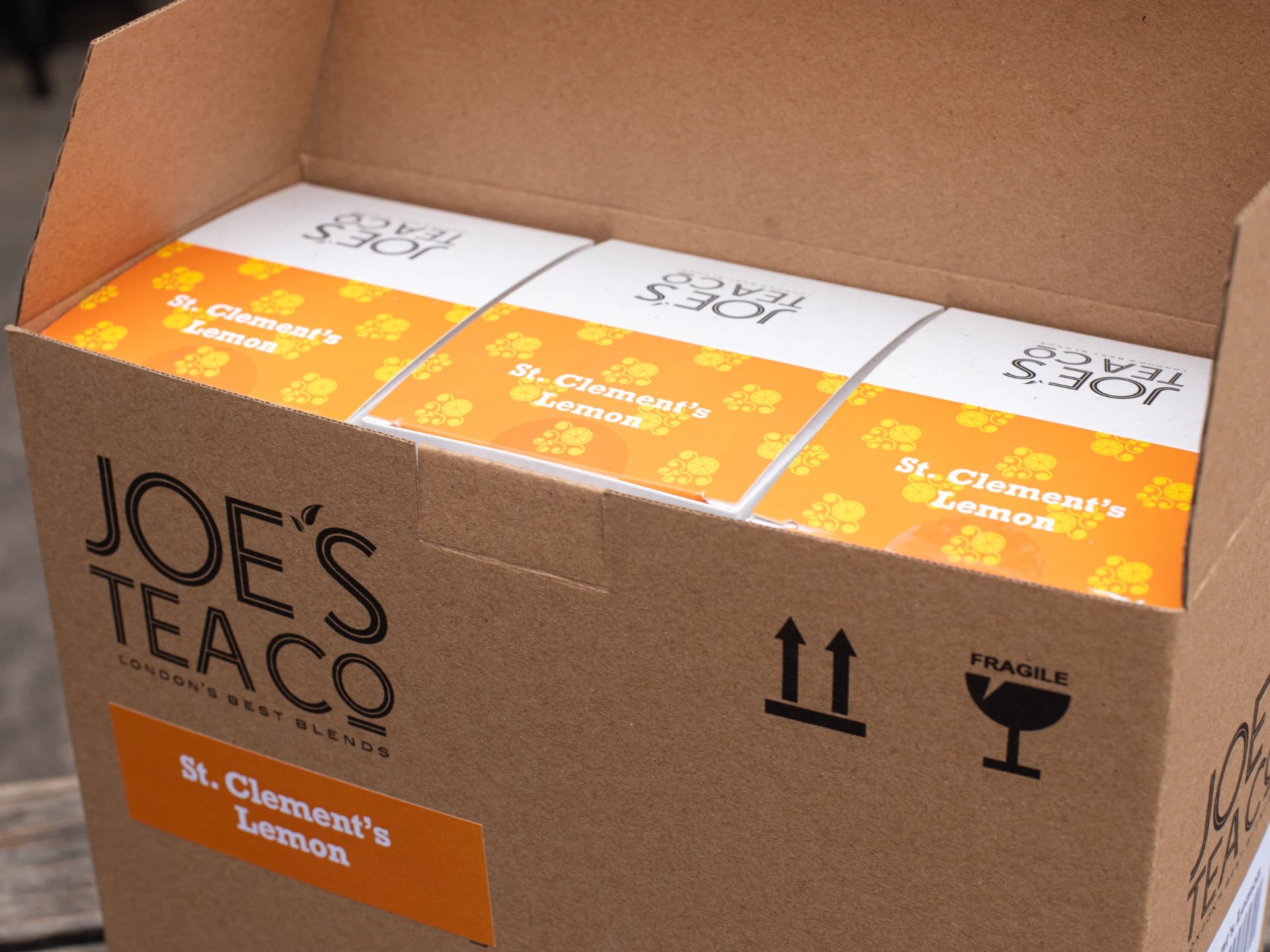 Box of Joe's Tea co  St. Clement's Lemon tea boxes with a cardboard box.