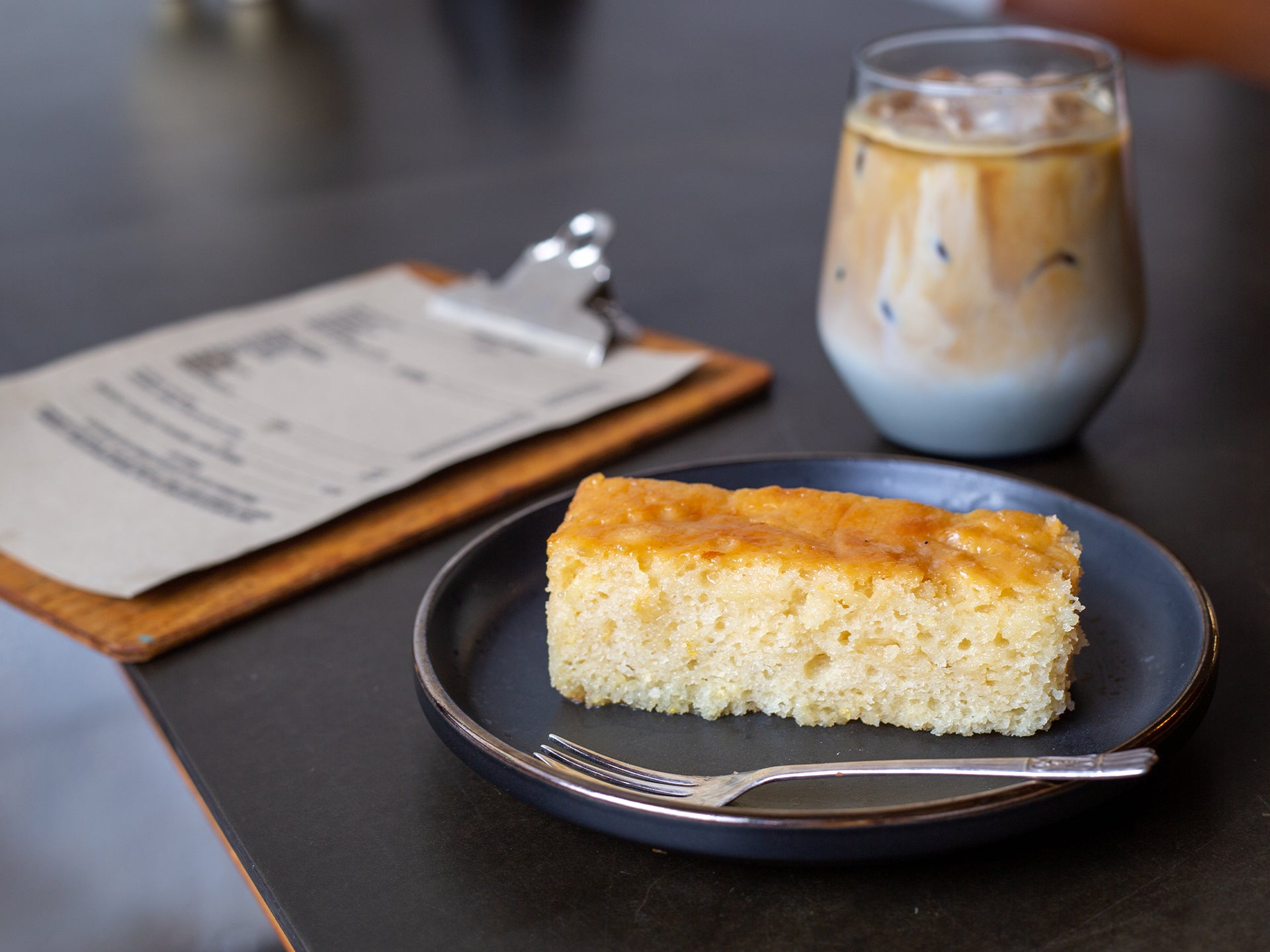 A slice of wholesale lemon drizzle cake from Cakesmiths