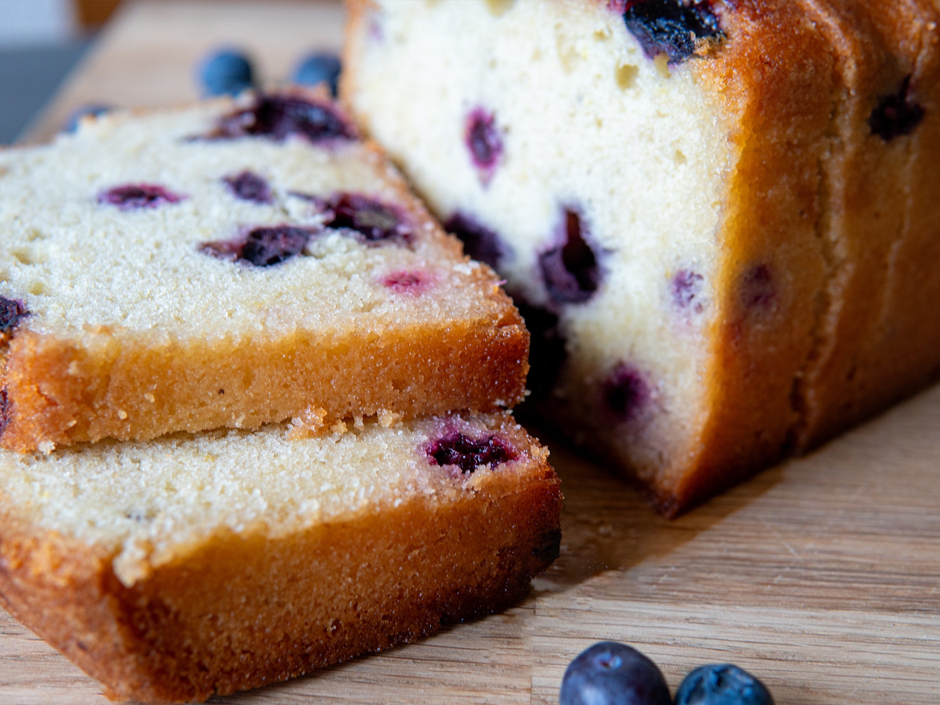 Close up of the moist crumb of our wholesale blueberry & lemon loaf