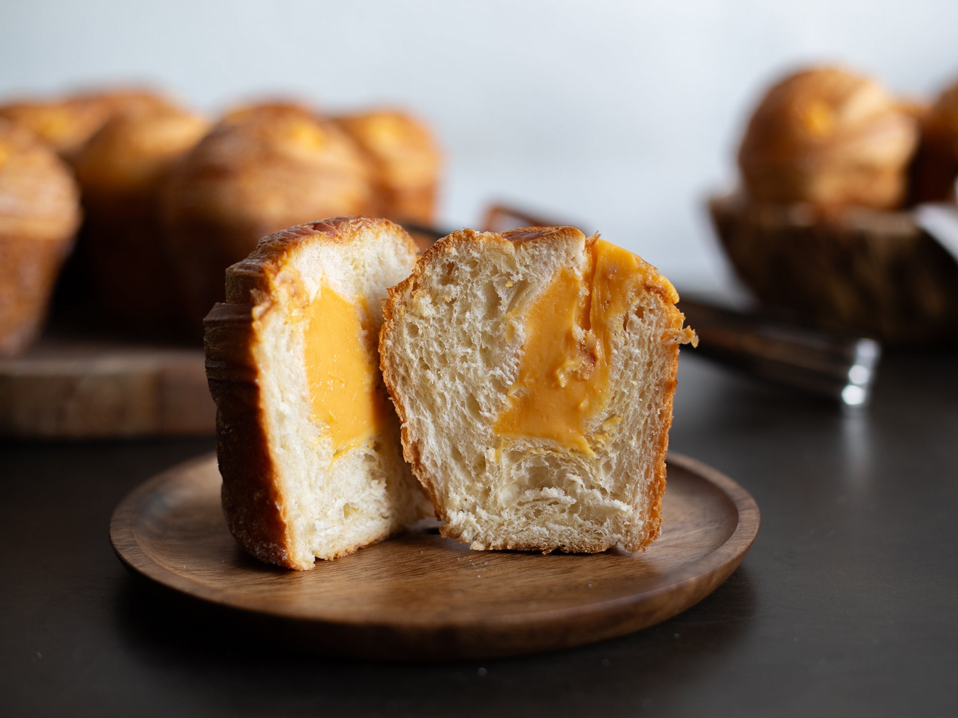 A cross-section of one of our Passionfruit Curd Cruffins