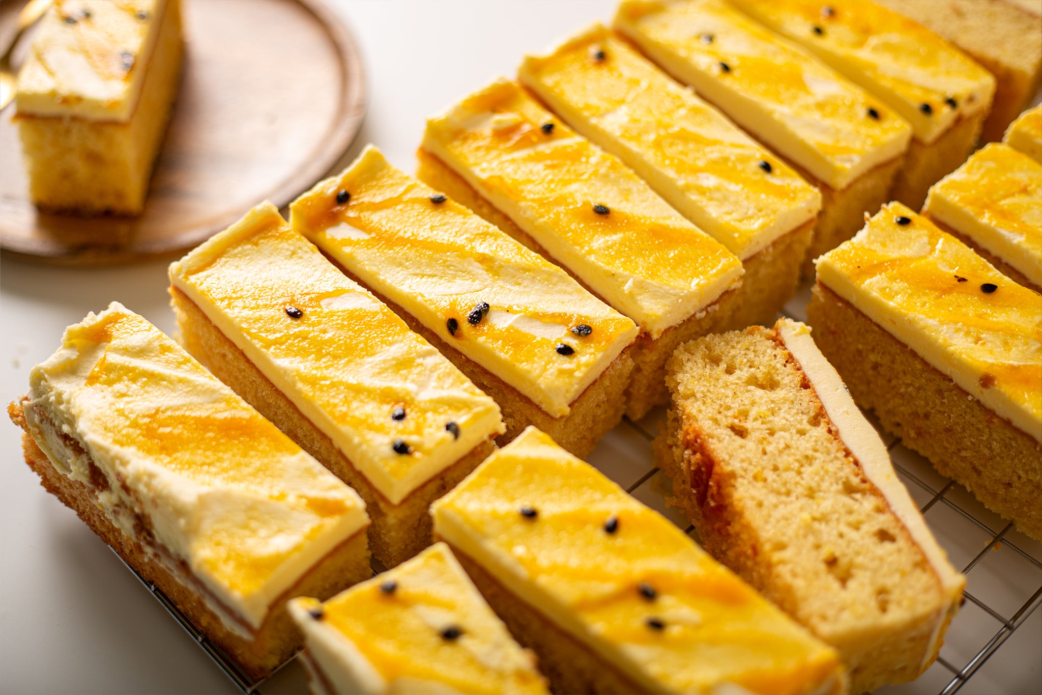 The vibrant icing on our summery wholesale passionfruit traycake