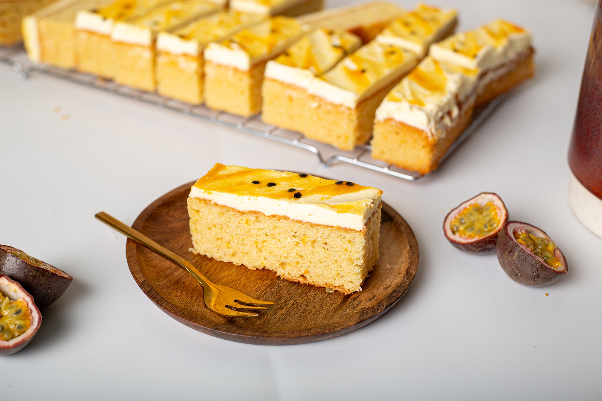 A slice of our Passionfruit Ripple Traycake