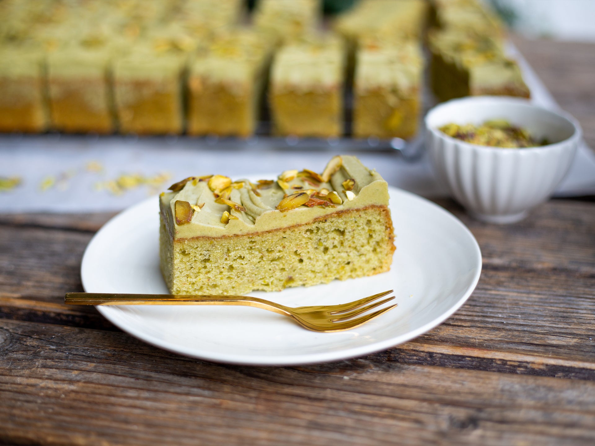 A slice of Pistachio Creme traycake