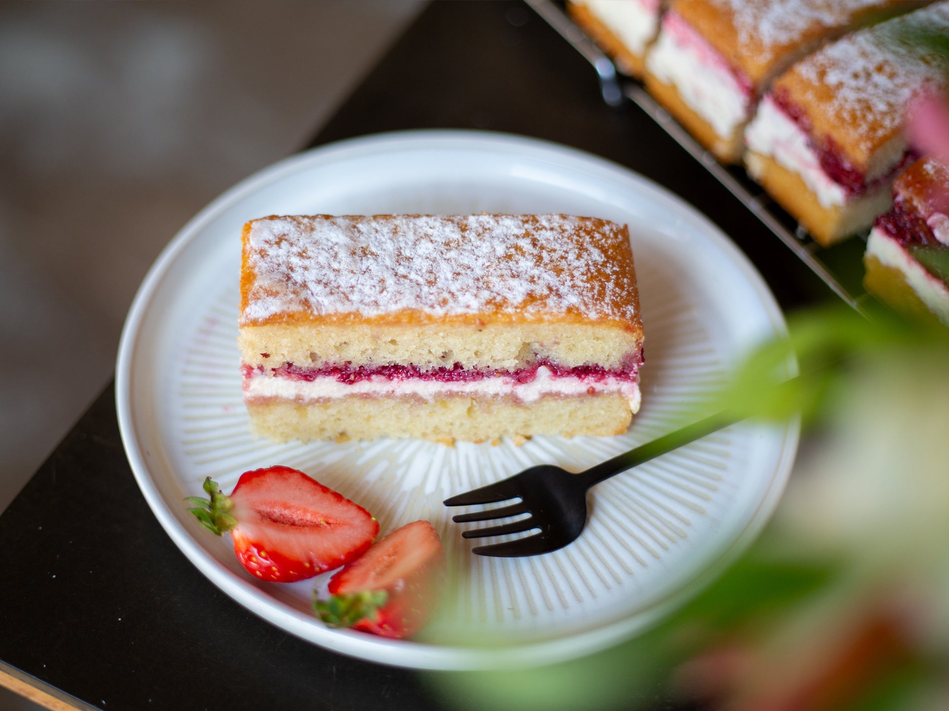 Add some slices of strawberry to our classic wholesale victoria sponge cake