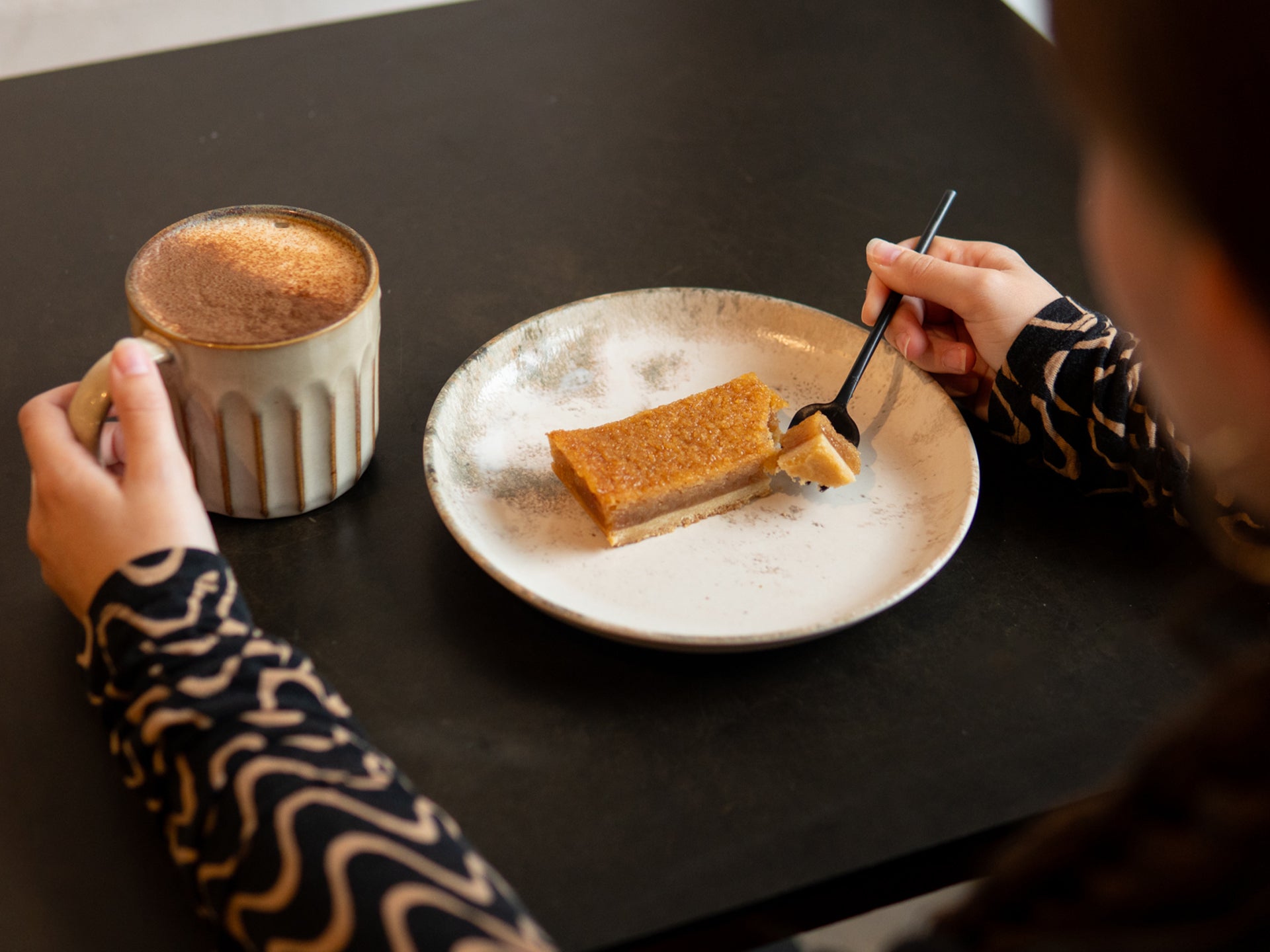 Tuck into a slice of our sourdough treacle tart with a cappuccino 