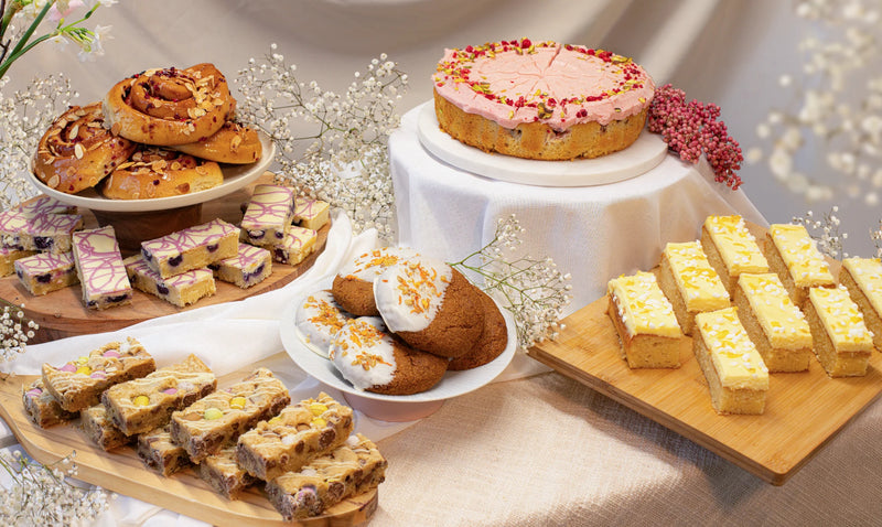 Assorted spring cakes on a table with a soft, neutral background