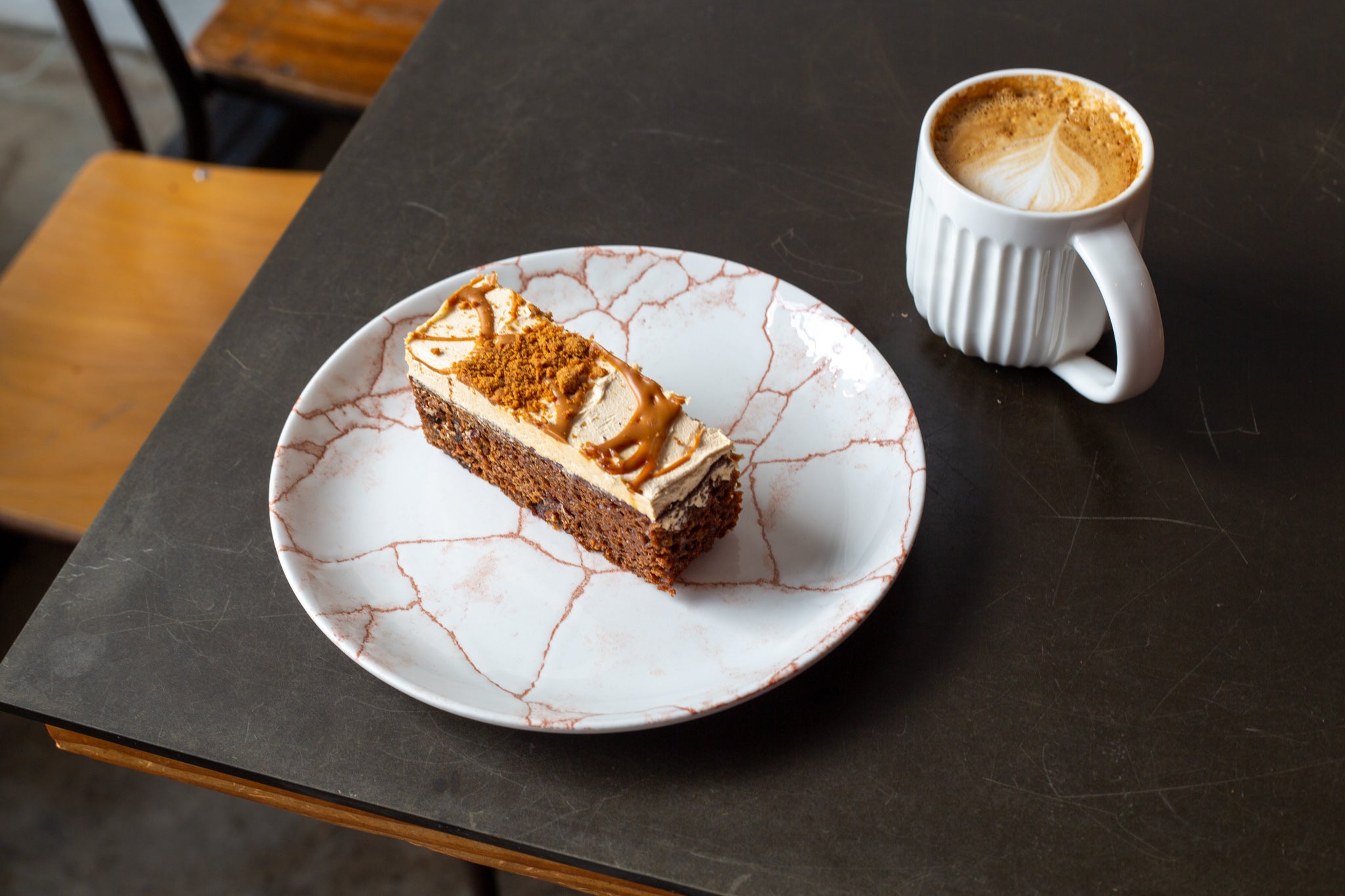 A slice of wholesale sticky toffee biscoff cake from Cakesmiths