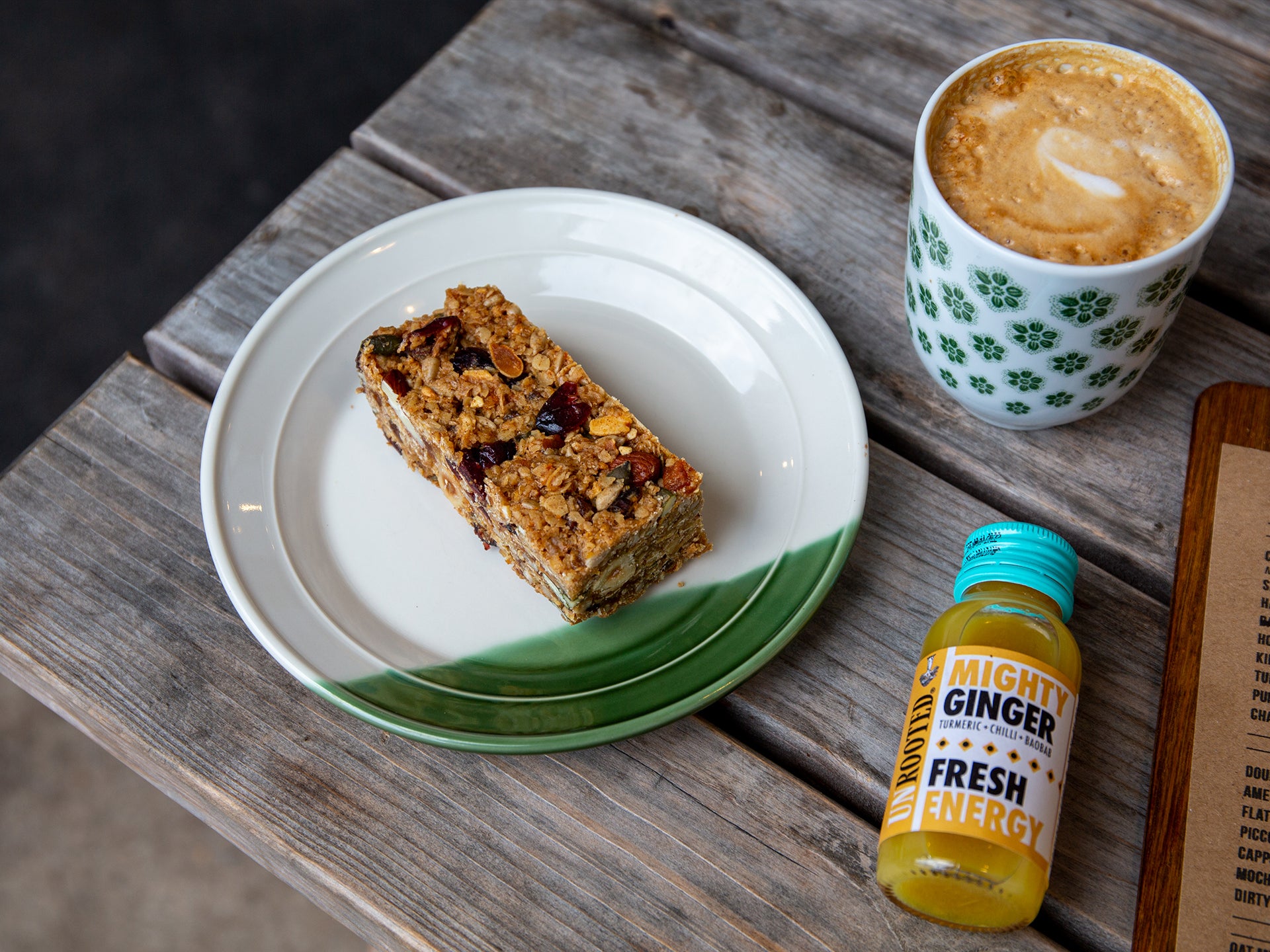 A slice of fruit and nut loaded flapjack, available in wholesale trays from Cakesmiths