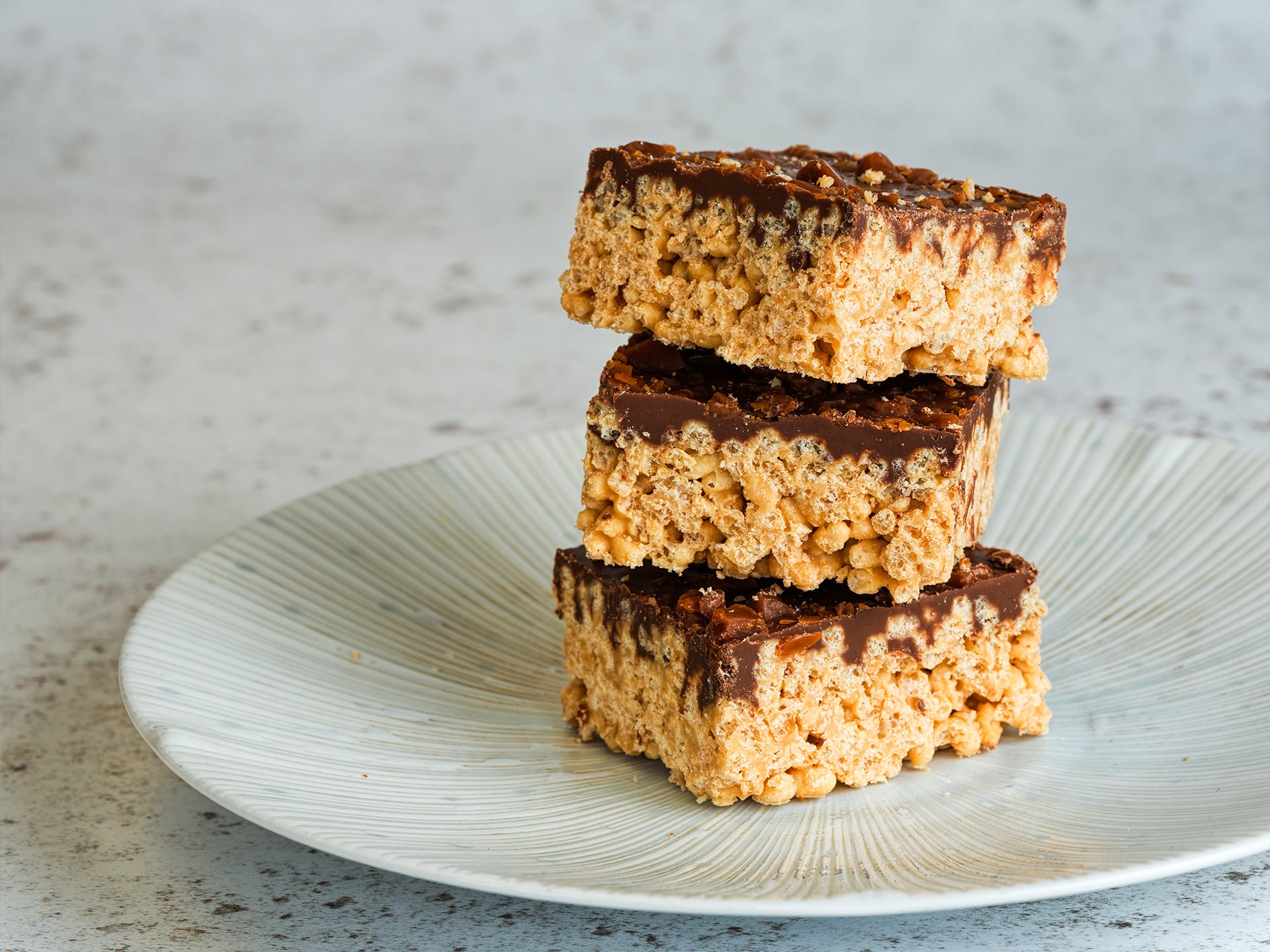 A stack of our Toffee Crispy Traybake - popular with all coffee shop customers!